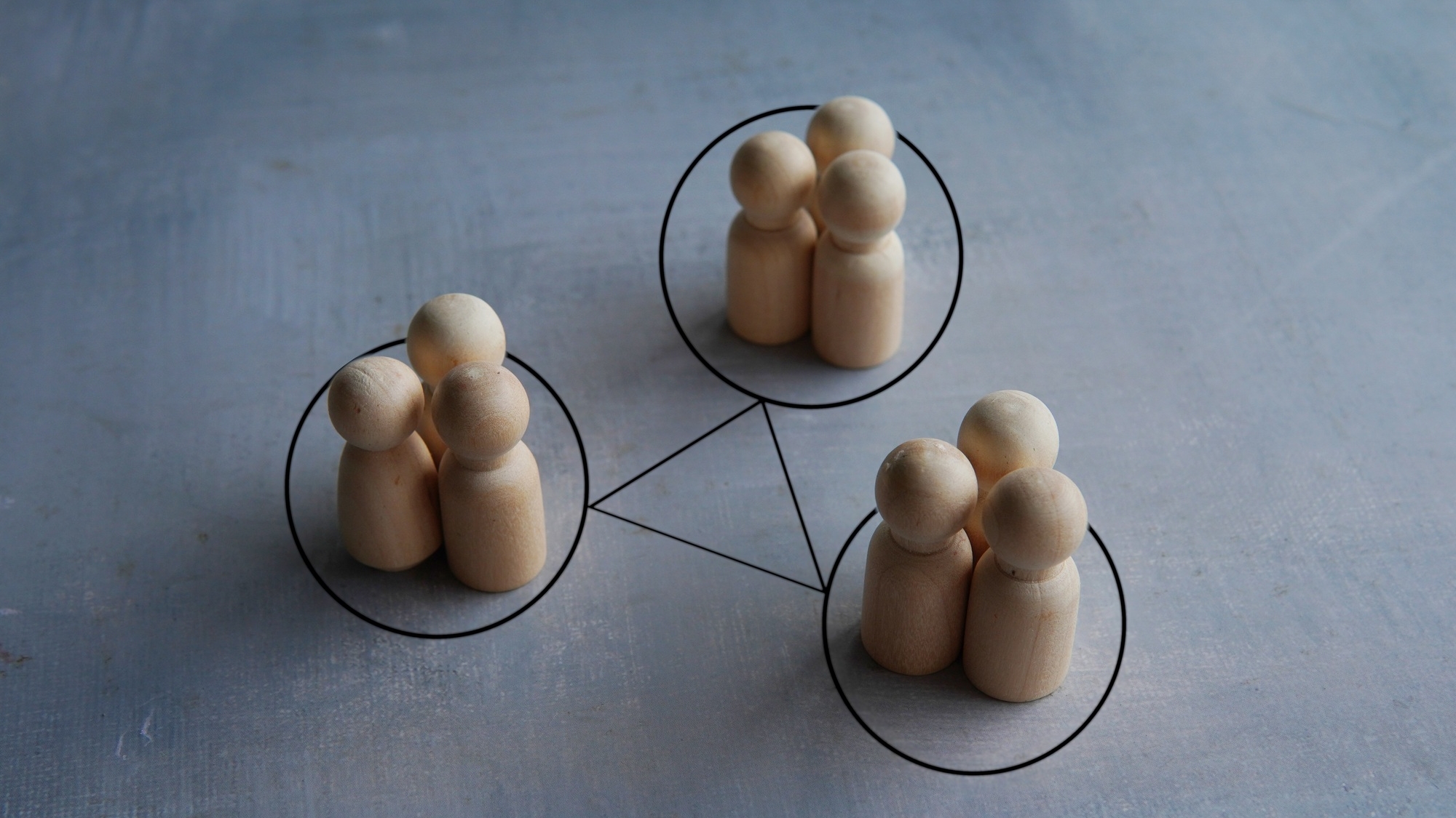 Groups of people are connected by lines.
