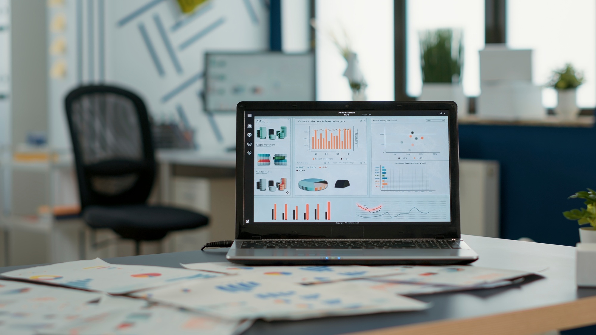 Closeup of laptop screen with enterprise resource planning showing moving charts and growing