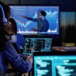 Male business trainer is against projector with data, teaching people
