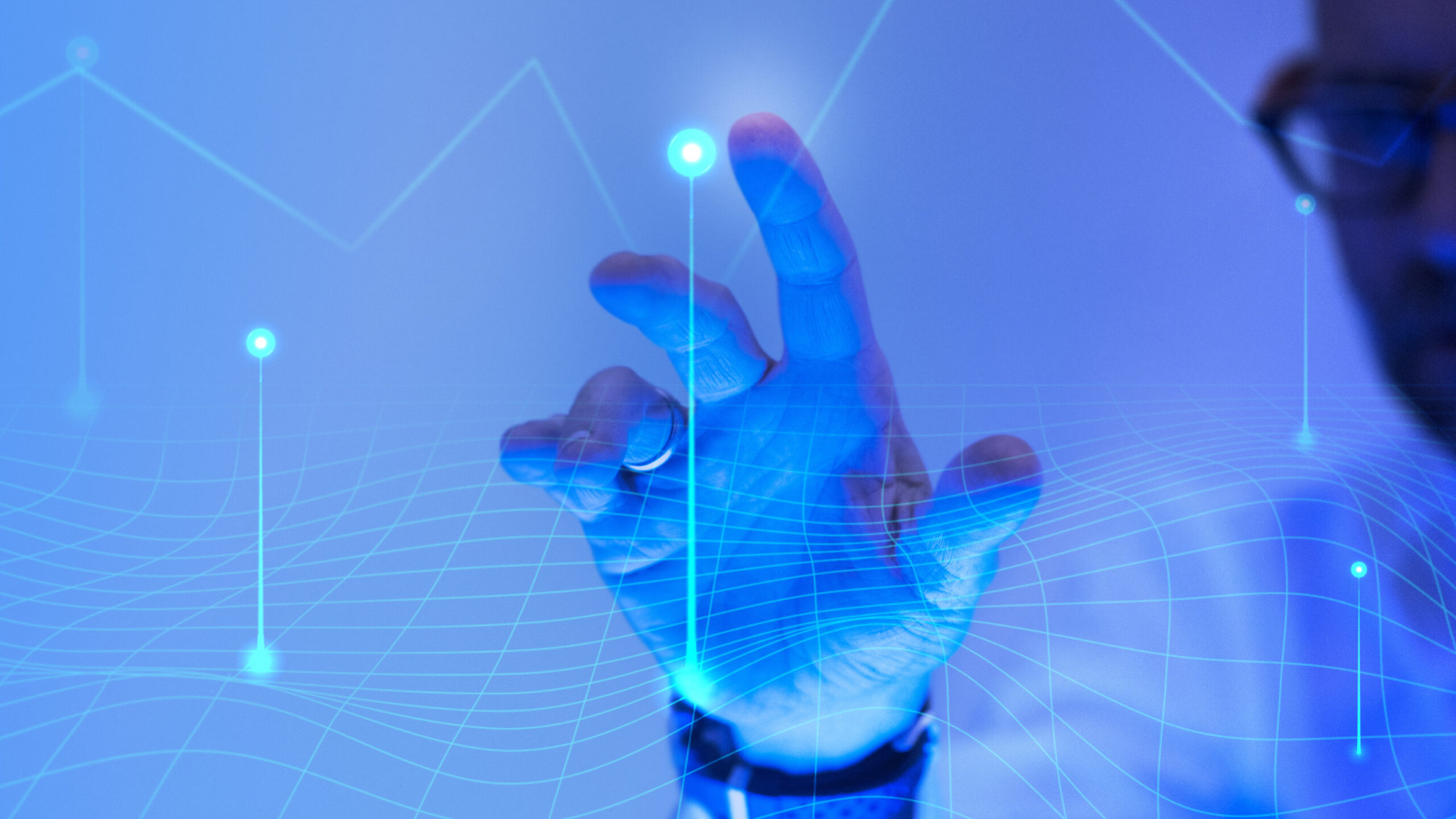 Man touching the futuristic blue screen