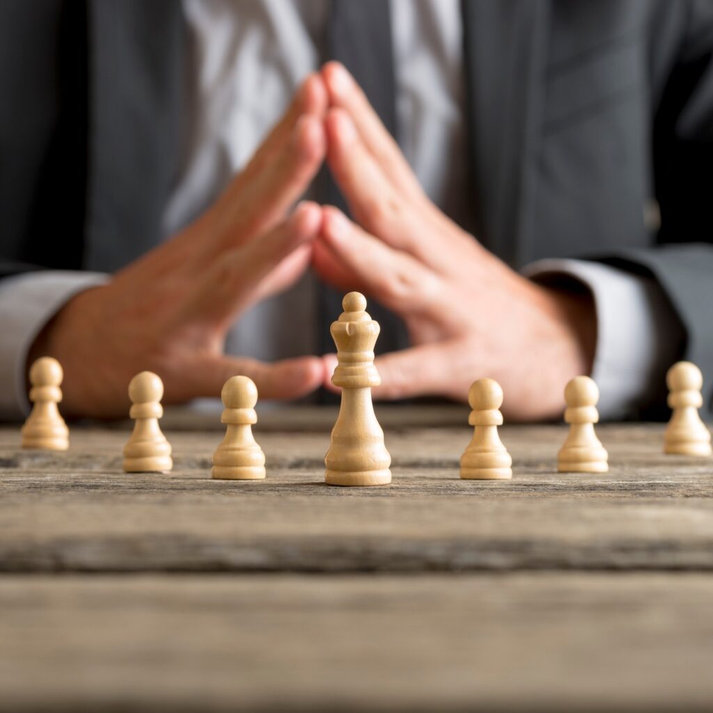 Businessman with clasped hands planning strategy