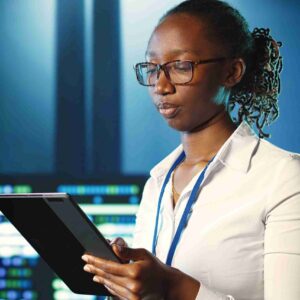 A data analyst looking at her tablet