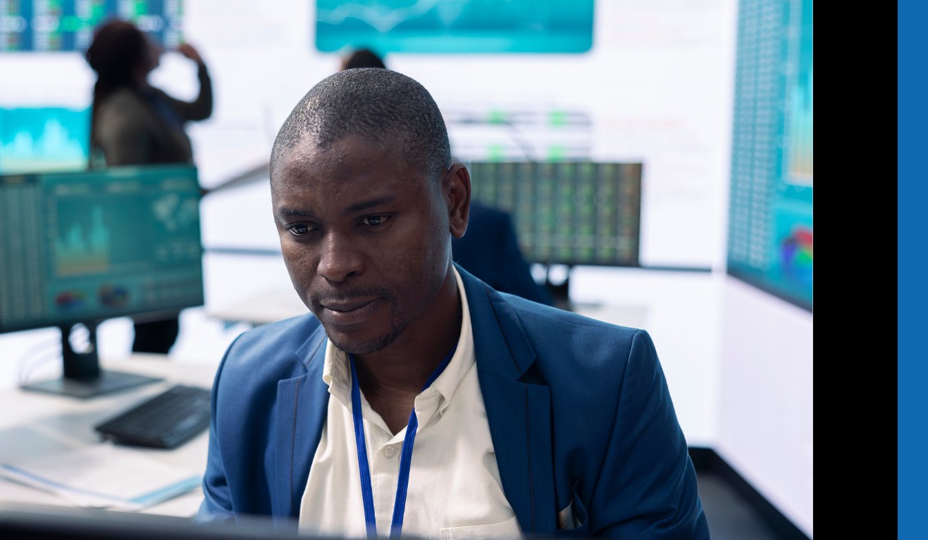 A DVT analyst seated at his desk, working on a problem