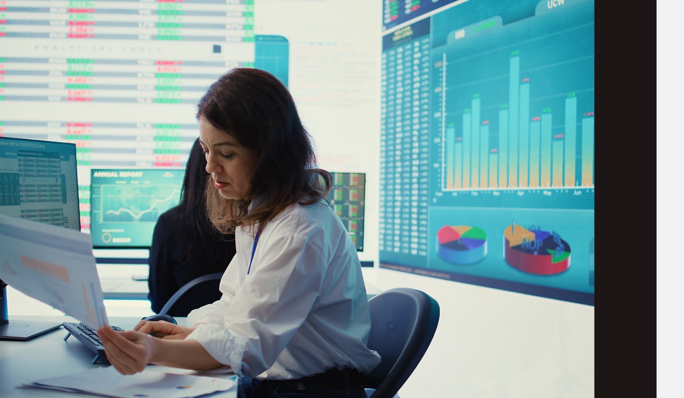 An Entelect analyst, seated at her seat, assessing a data sheet