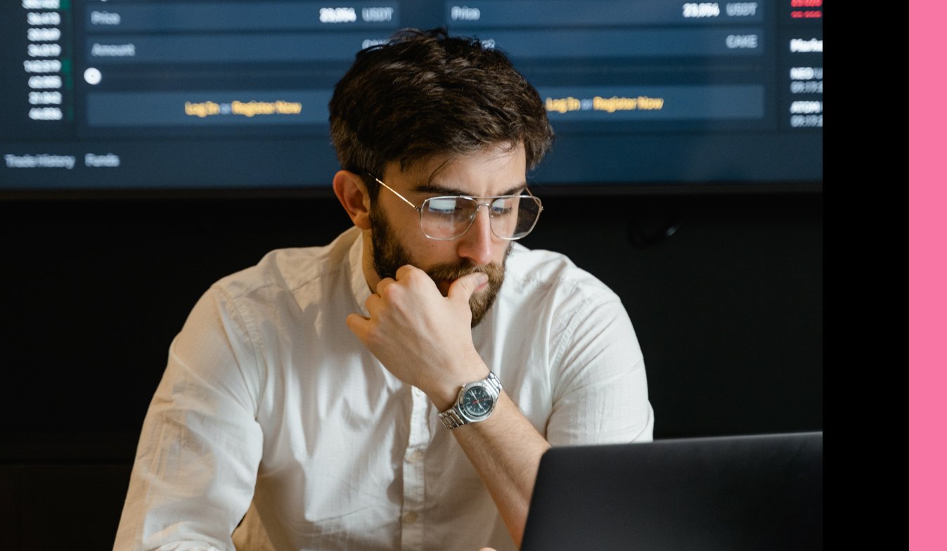 An Inteleqt data analyst working on a problem on his laptop