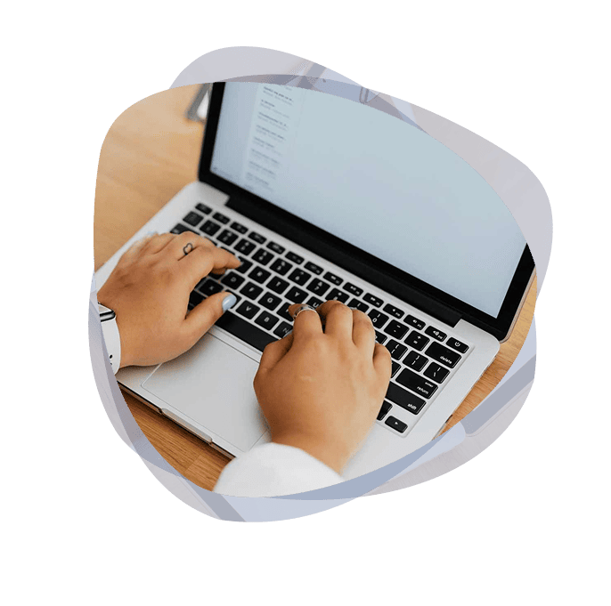 A professional using Microsoft cloud storage to access files on laptop.