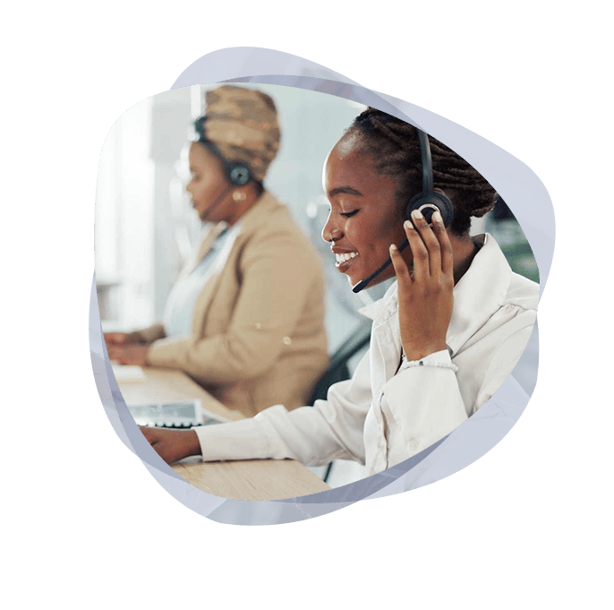 Microsoft cloud support consultant smiling and using headset.