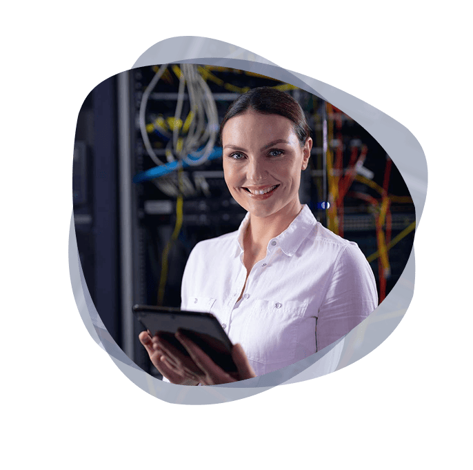An Azure Cloud Integration specialist from the Mint Group smiling, wearing a white shirt and holding a tablet.