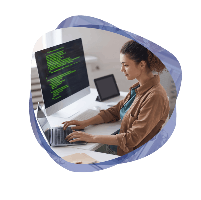 Software engineer at a workstation developing low-code and pro-code Microsoft AI Solutions.