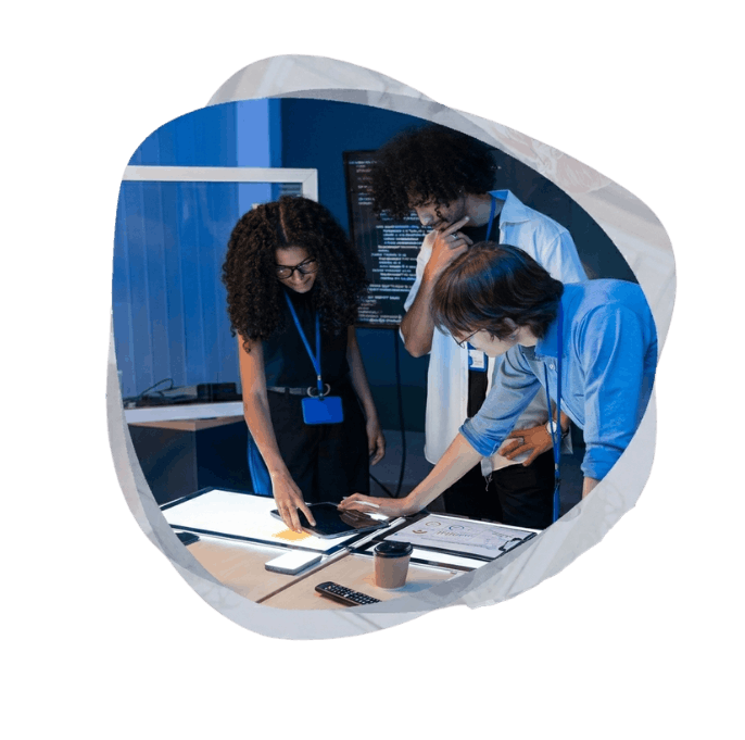 Tech experts analyzing integrated system charts to optimize efficiency using Business Process Automation Services.